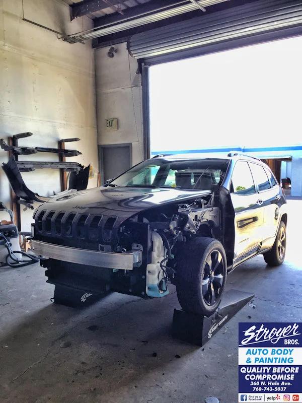 A vehicle undergoing collision repair at Stroyer Brothers